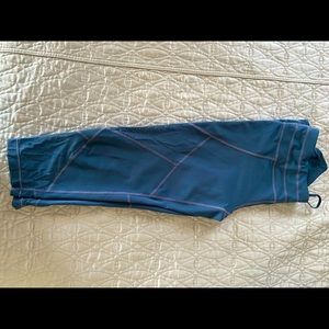 Blue, Athleta workout pants with peekaboo cut outs. Crop/mid calf